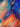 Detail of texture and expressive color in portrait of a woman underwater surrounded by whales.
