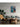 Framed painting on living room wall. The painting shows the portrait of a woman underwater surrounded by whales.